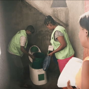 SOIL team installing EkoLakay toilet for client in Cap-Haitien. 