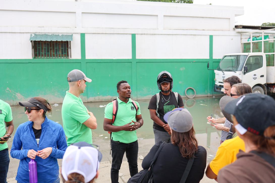 Gerald Cadet talking to group of visitors