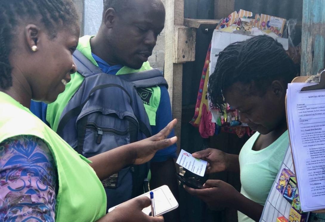 EkoLakay team members with customer