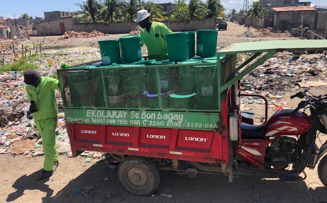 EkoLakay workers using digital tools for collection